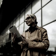 a lady reading the prenuptial agreement on her gadget