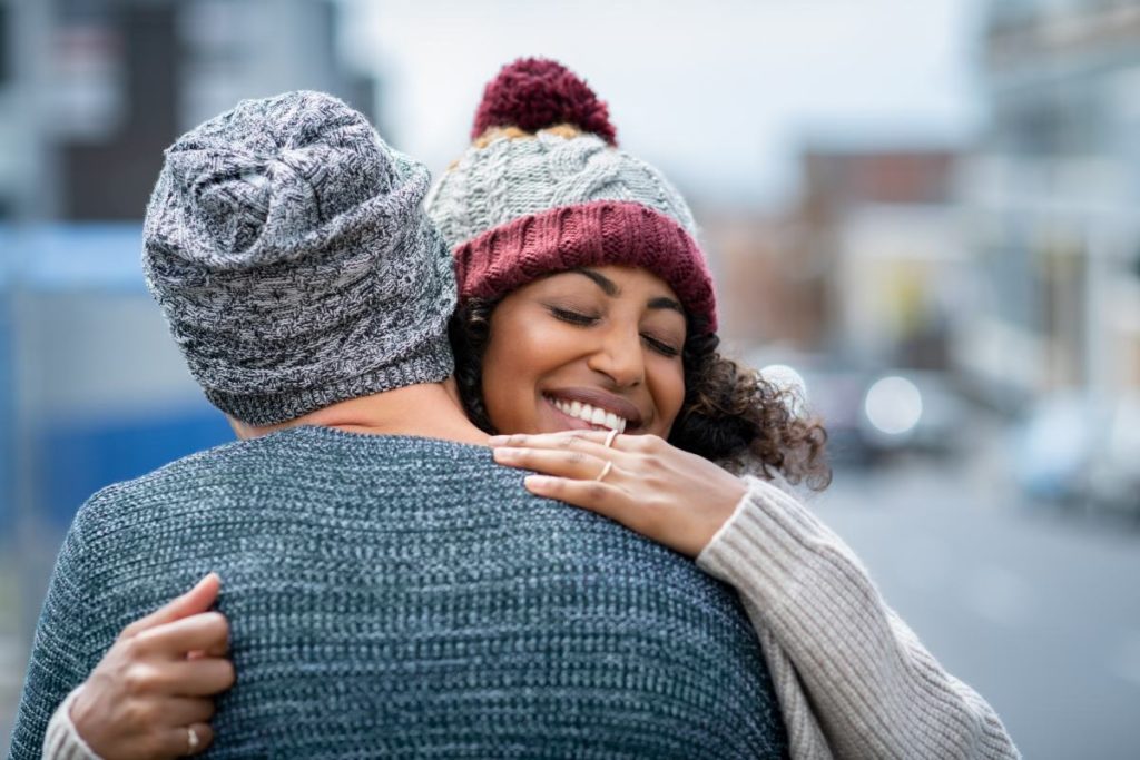 A couple giving each other a hug