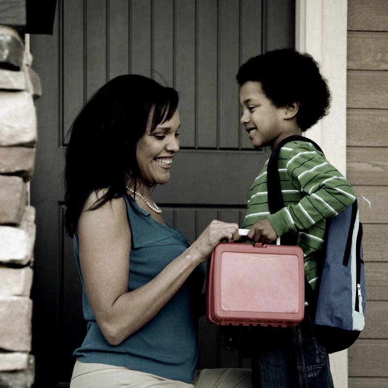 Mother Gets Child Ready For School Min